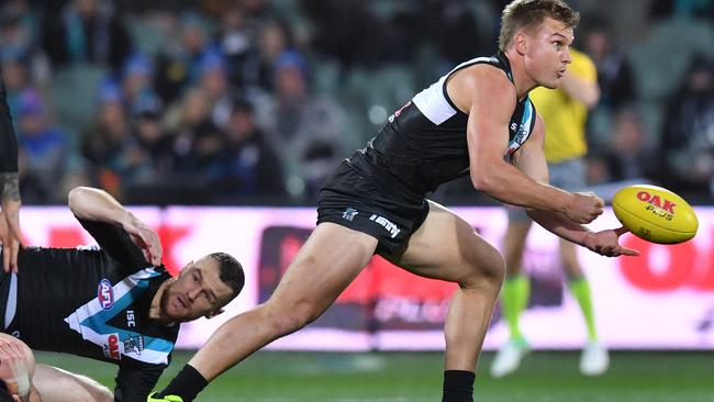 Port vice-captain Ollie Wines fires off a handball in the big win against the Western Bulldogs. Picture: AAP Image/David Mariuz