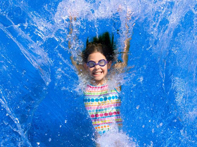 Child falling back into a swimming pool