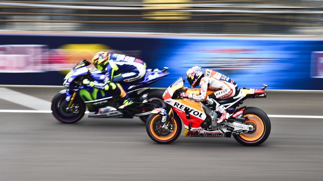 Pedrosa ranges up alongside Rossi on the final lap.