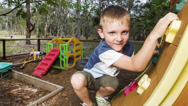 Eli Campbell plays at home at Agnes Waters in his custom built snakeproof play area.  Picture: Lachie Millard