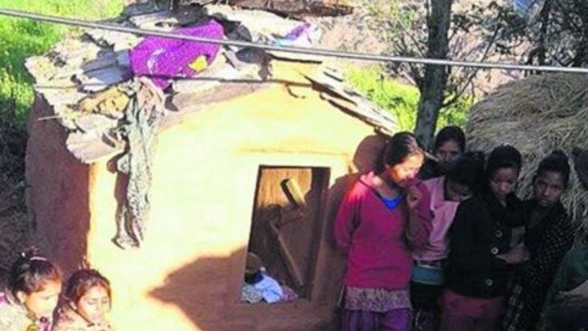Roshani Tiruwa's family and friends gather after she was found dead in the hut after starting a fire to keep warm. She was in the third day of mendstuating. Picture: Ashok Dahal
