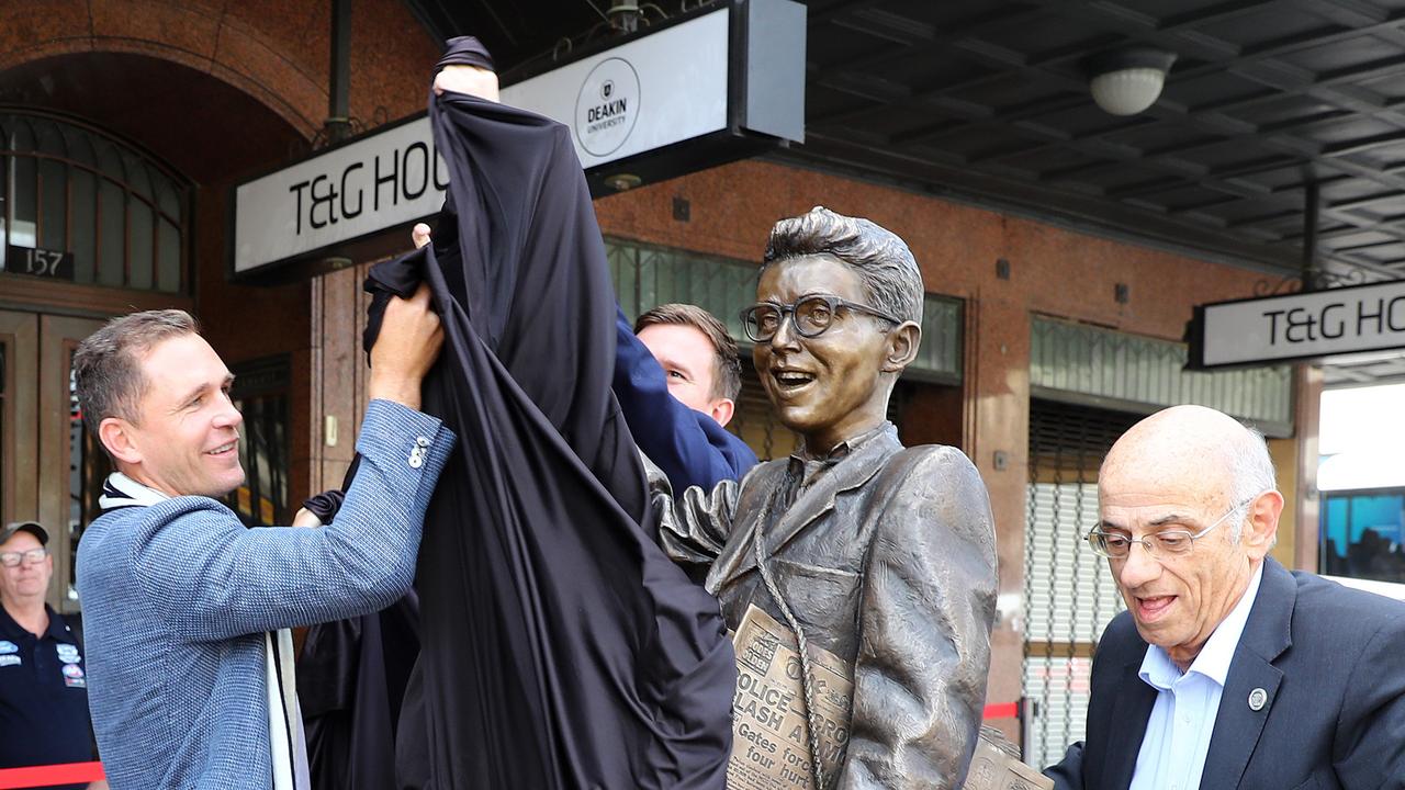 Joel Selwood and Robert Costa unveil the Frank Costa statue in Moorabool St. Picture: Alison Wynd