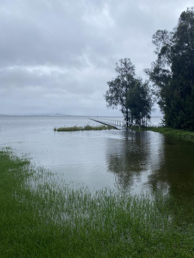 The jetty at Long Jetty was almost under water on Thursday morning with evacuation orders remaining in place. Picture: Dana Pendrick