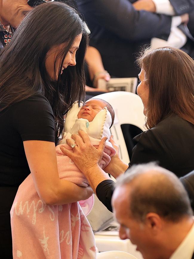 Jenny Morrison greets Leila Abdallah and baby daughter Selina. Picture: Toby Zerna