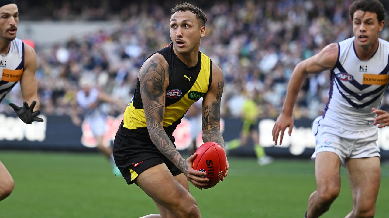 MELBOURNE, AUSTRALIA - MAY 05: Shai Bolton of the Tigers looks to handball during the round eight AFL match between Richmond Tigers and Fremantle Dockers at Melbourne Cricket Ground, on May 05, 2024, in Melbourne, Australia. (Photo by Daniel Pockett/Getty Images)