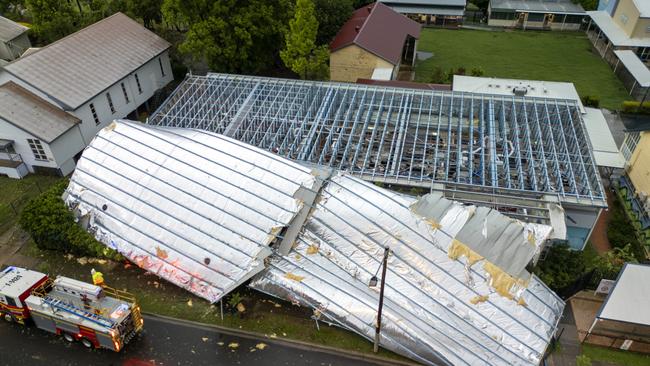 Manly State School on Ernest Street loses its roof after a severe thunderstorm hits Brisbane.