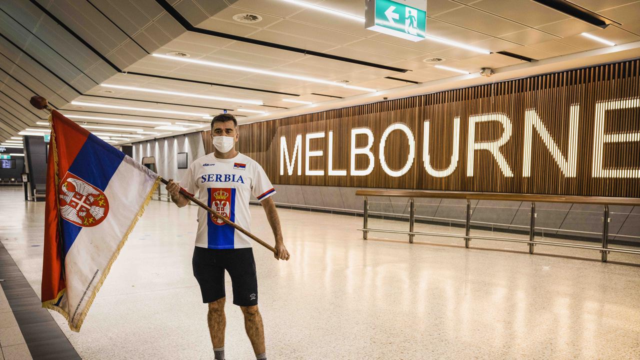 Novak Djokovic supporter Slobovich Bendjo at Melbourne Airport in the early hours of Thursday morning. Picture: Nicole Cleary