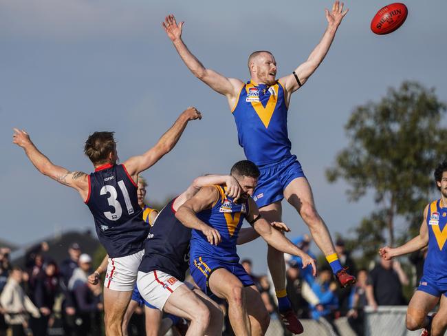 SFNL: Cranbourne’s Mitchell White flies highest. Picture: Valeriu Campan