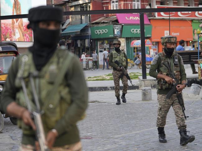 Indian soldiers guard at a market in Srinagar, Indian controlled Kashmir, Tuesday, May 6, 2025. (AP Photo/Mukhtar Khan)
