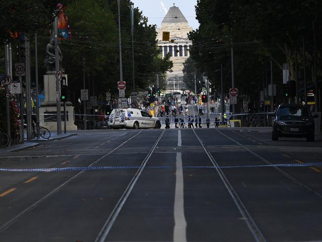 Police seen on Swanston St after the mayhem began.