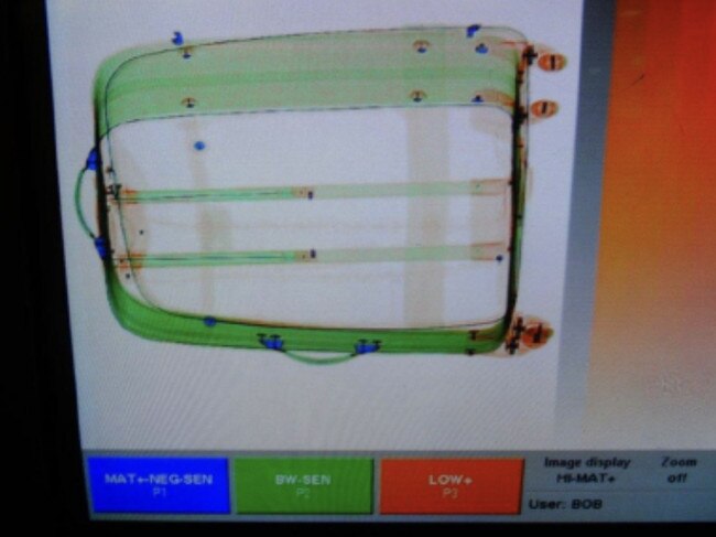 An X-ray image of drugs concealed in luggage