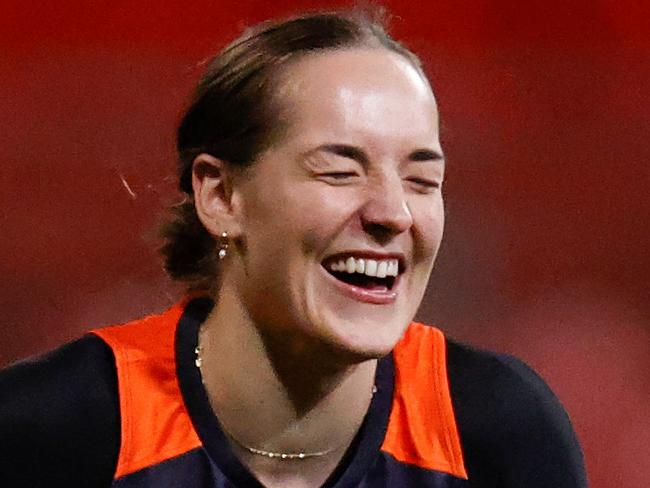 SYDNEY, AUSTRALIA - AUGUST 11: Isabel Huntington of the Giants shares a joke during the GWS Giants AFLW training session at Giants Stadium on August 11, 2022 in Sydney, Australia. (Photo by Michael Willson/AFL Photos via Getty Images)