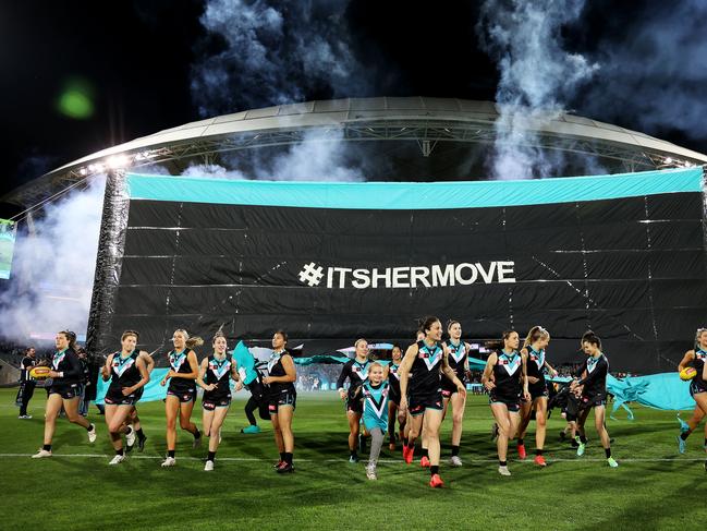 The Power run out during the 2022 S7 AFLW Round 06 match between the Adelaide Crows and the Port Adelaide Power at Adelaide Oval.