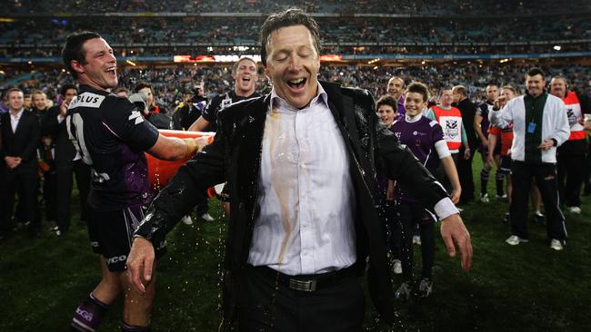 Coach Craig Bellamy cops the mandatory bucketing after the 2009 grand final.