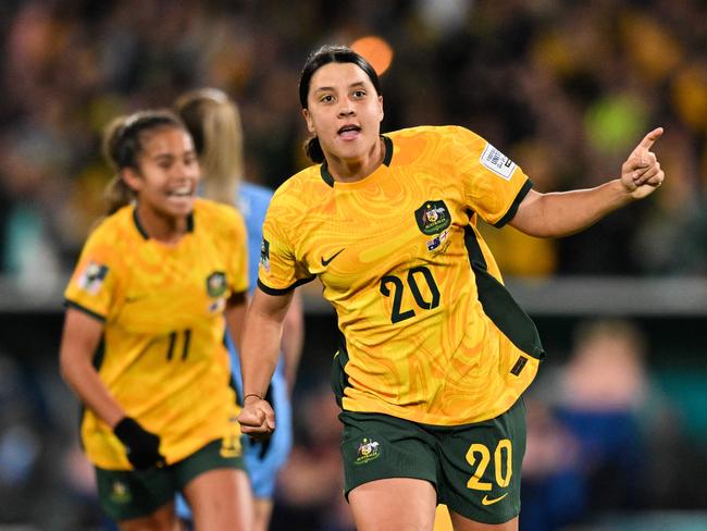 FILES-- This file photo taken on August 16, 2023 shows Australia's forward Sam Kerr celebrating scoring her team's first goal during the Australia and New Zealand 2023 Women's World Cup semi-final football match between Australia and England at Stadium Australia in Sydney. Chelsea and Australian women's football star Sam Kerr has been charged with a "racially aggravated offence" in Britain following a dispute involving a police officer, London's Metropolitan Police said March 4. The 30-year-old striker, one of the highest profile and best-paid players in the women's game, was charged following an incident in London in January 2023, a police statement read. (Photo by IZHAR KHAN / AFP)