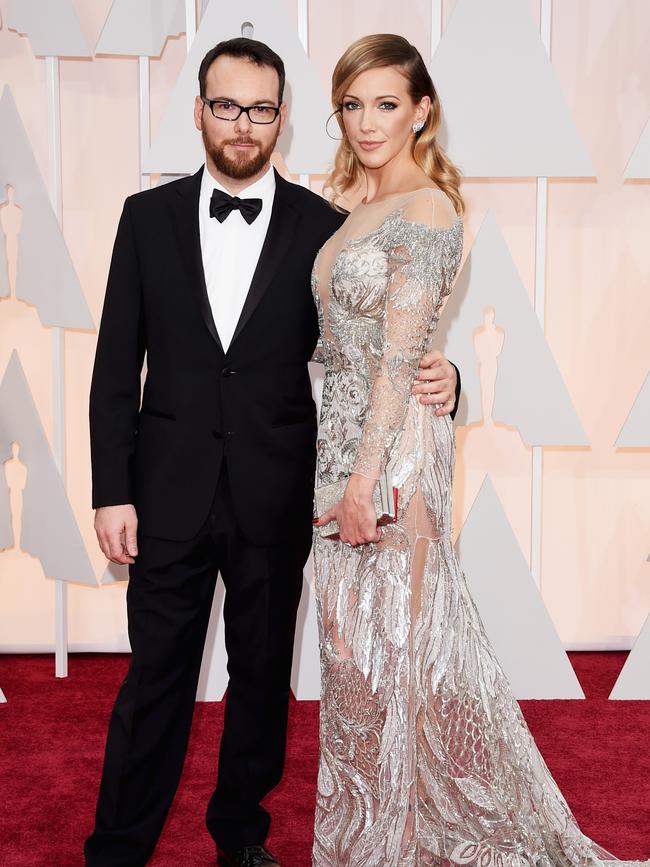 Producer Dana Brunetti and actress Katie Cassidy at the Oscars 2015 red carpet. Picture: Getty