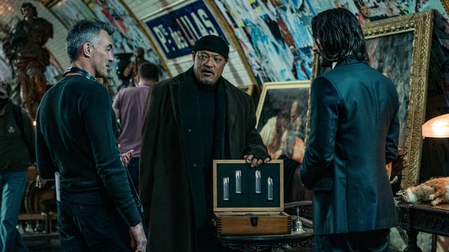 Director Chad Stahelski, Laurence Fishburne and Keanu Reeves on the set of John Wick: Chapter 4. Picture: Murray Close