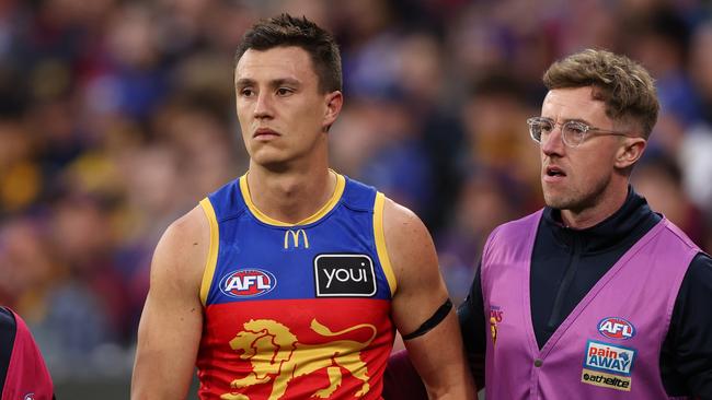MELBOURNE, AUSTRALIA - JUNE 10: Hugh McCluggage of the Lions is taken from the ground after a collision during the round 13 AFL match between Hawthorn Hawks and Brisbane Lions at Melbourne Cricket Ground, on June 10, 2023, in Melbourne, Australia. (Photo by Robert Cianflone/Getty Images)
