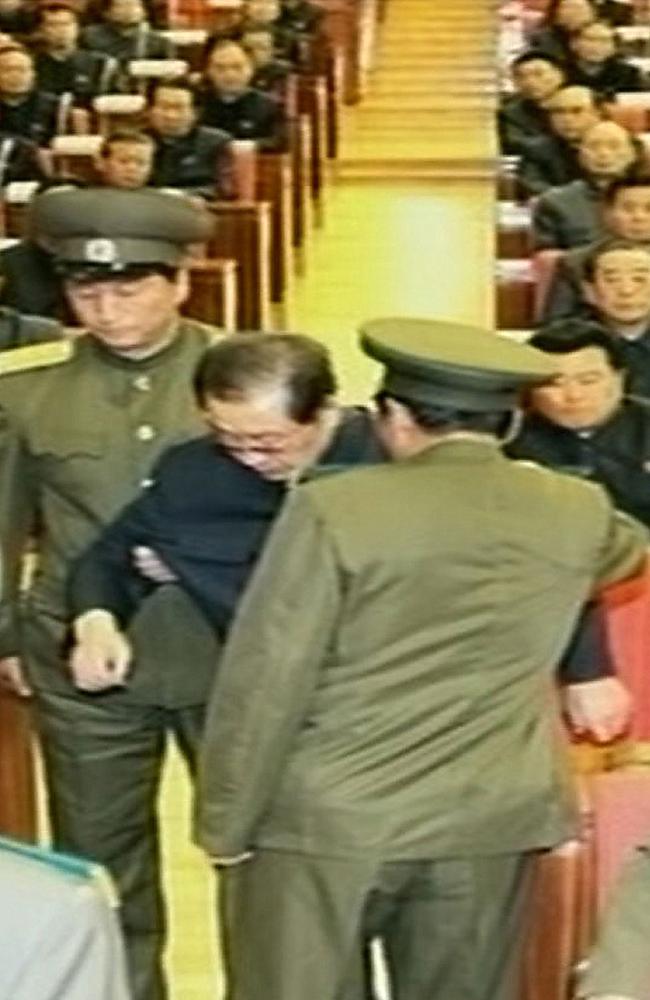 This grab taken from footage shown by North Korea's KCTV shows Jang Song-Thaek being dragged out from his chair by two police officials during a meeting in Pyongyang. North Korea confirmed that the powerful uncle of young leader Kim Jong-un had been purged.