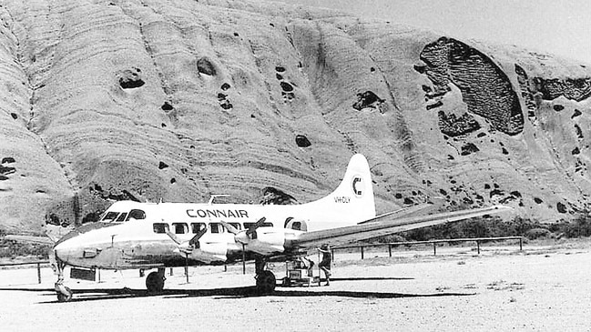 A plane on the airstrip at the base of Ayers Rock in 1968.