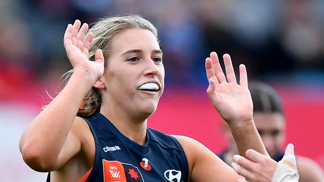 MELBOURNE, AUSTRALIA - SEPTEMBER 14: Abbie McKay of the Blues is congratulated by Celine Moody after kicking a goal during the round three AFLW match between Carlton Blues and Geelong Cats at Ikon Park, on September 14, 2024, in Melbourne, Australia. (Photo by Josh Chadwick/AFL Photos/via Getty Images)