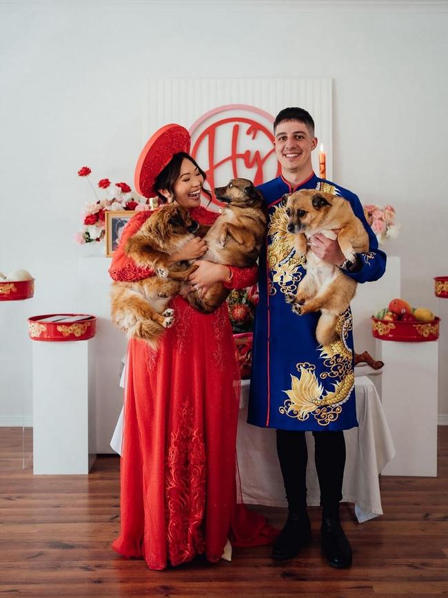 Dao and Kris Pazios at their Vietnamese tea ceremony with their three dogs. Picture: Life Sketch Weddings