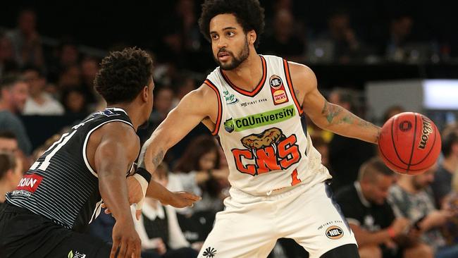 Melo Trimble of Cairns (right) under pressure from Casper Ware of Melbourne during the Round 18 NBL match between Melbourne United and the Cairns Taipans at Melbourne Arena in Melbourne, Thursday, February 14, 2019. (AAP Image/Hamish Blair) NO ARCHIVING, EDITORIAL USE ONLY