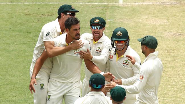 Mitchell Starc celebrates after taking the wicket of Murali Vijay of India during day two of the second test match in Perth on Saturday. Picture: Getty