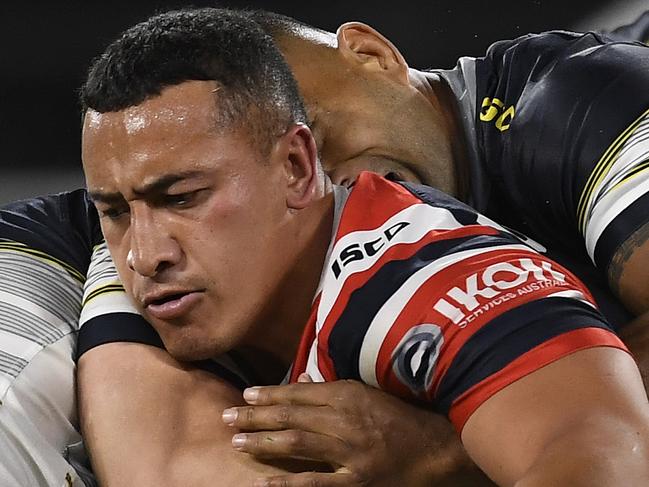 TOWNSVILLE, AUSTRALIA - JULY 09:  Siosiua Taukeiaho of the Roosters is tackled during the round nine NRL match between the North Queensland Cowboys and the Sydney Roosters at QCB Stadium on July 09, 2020 in Townsville, Australia. (Photo by Ian Hitchcock/Getty Images)