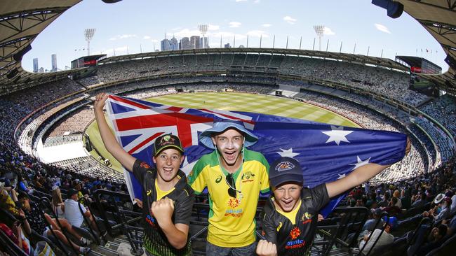 Aussie cricket fans Harry 13, Walker 17 and Hudson 13 cheer on their idols in a limited COVID capacity MCG. Picture: David Caird