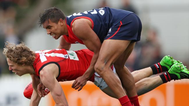 Casey’s Jay Kennedy-Harris falls over Bomber Jake McQueen.