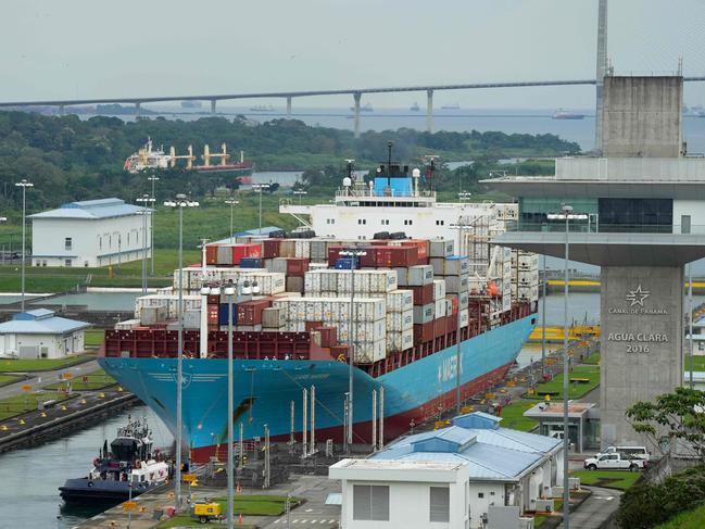 (FILES) The Danish cargo ship Lars Maersk sails through the Agua Clara Locks of the Panama Canal in Colon City, Panama, on December 28, 2024. Panama on January 20, 2024, rejected President Donald Trump's pledge that the United States would be "taking back" the Panama Canal, saying the key interoceanic waterway would remain under its control. "The canal is and will remain Panama's," President Jose Raul Mulino said in a statement published on social media. (Photo by ARNULFO FRANCO / AFP)