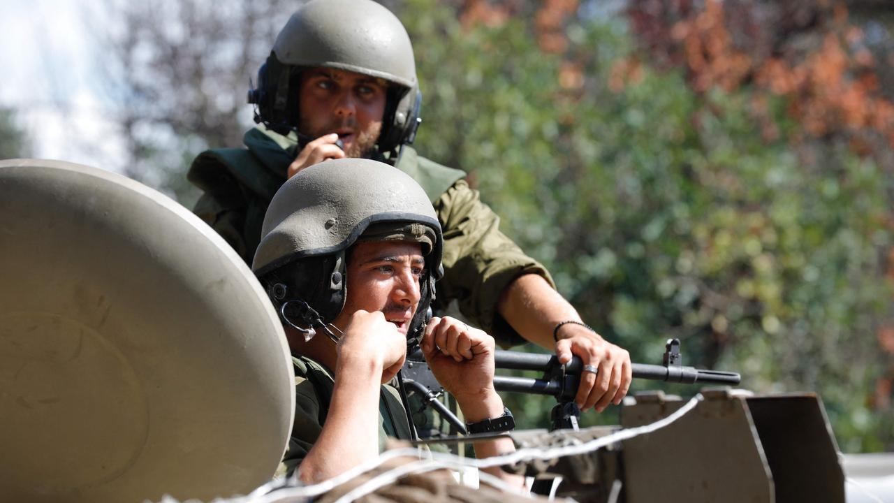 Israeli soldiers take a position in the northern town of Kiryat Shmona close to the border with Lebanon. Israeli police will be arming thousands of civilians and enlisting them. Picture: AFP