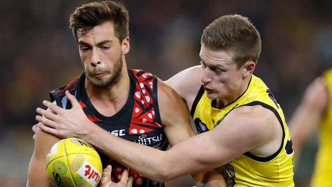 Essendon’s Kyle Langford is grabbed by Richmond’s Connor Menadue in the 2018 Dreamtime Game at the MCG. Now it is Darwin’s turn to host the AFL classic. Picture: Adam Trafford/AFL Media/Getty Images.