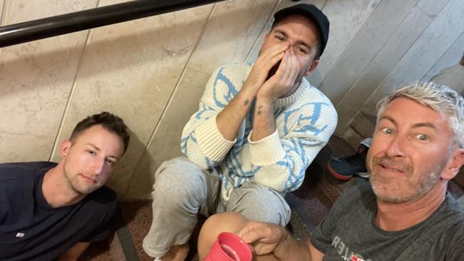 Hugh Sheridan (centre) shelters with friends including David Draper (right) in an Israeli hotel stairwell. Picture: Instagram/David Anthony Draper