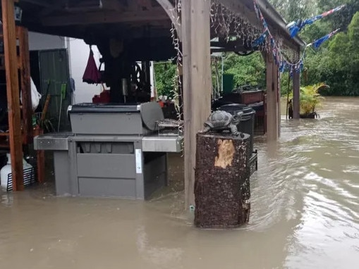 Cardwell family and neighbours devastated by rising floodwaters. Picture: Supplied.