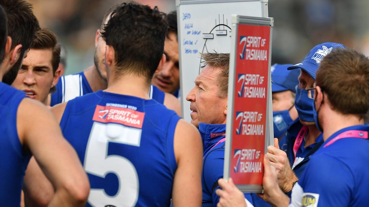 HOBART, AUSTRALIA – JULY 31: David Noble coach of the Kangaroos addresses the players during the round 20 AFL match between North Melbourne Kangaroos and Geelong Cats at Blundstone Arena on July 31, 2021 in Hobart, Australia. (Photo by Steve Bell/AFL Photos/via Getty Images)