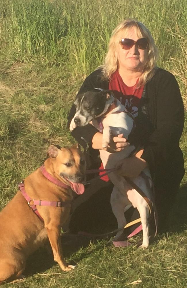 Jayne and her two dogs at Speers Point Park last year. She's calling for dog owners to be more responsible.