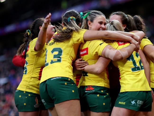 MANCHESTER, ENGLAND - NOVEMBER 19: Evania Pelite of Australia celebrates their sides tenth try with teammates during the Women's Rugby League World Cup Final match between Australia and New Zealand at Old Trafford on November 19, 2022 in Manchester, England. (Photo by Naomi Baker/Getty Images)