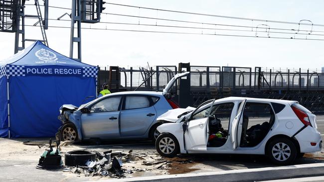 Police crash investigators collecting evidence after a fatal crash on the Sydney Harbour Bridge. Picture: Jonathan Ng