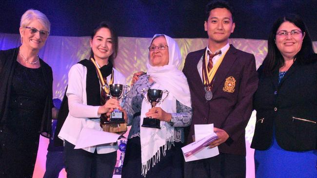 St James College 2019 Duxes Anjeela Khaliq (left) and her brother, Ali Sina Khaliq collecting their awards with their mother. Picture: St James College