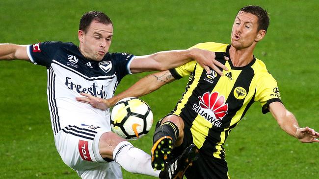 Melbourne Victory’s Leigh Broxham (left) and Wellington’s Nathan Burns compete for the ball.