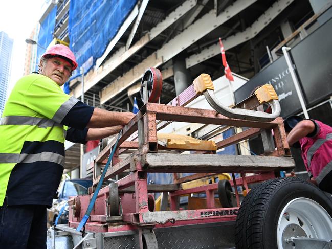 Sub-contractors and tradesmen pack up their equipment and walk off the 443 Queens Street construction site in Brisbane. Picture: NCA NewsWire / Dan Peled