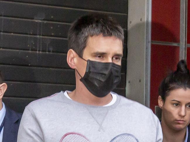 Melbourne Crash Porsche driver Richard Pusey is taken from his home by police. Picture: Tim Carrafa