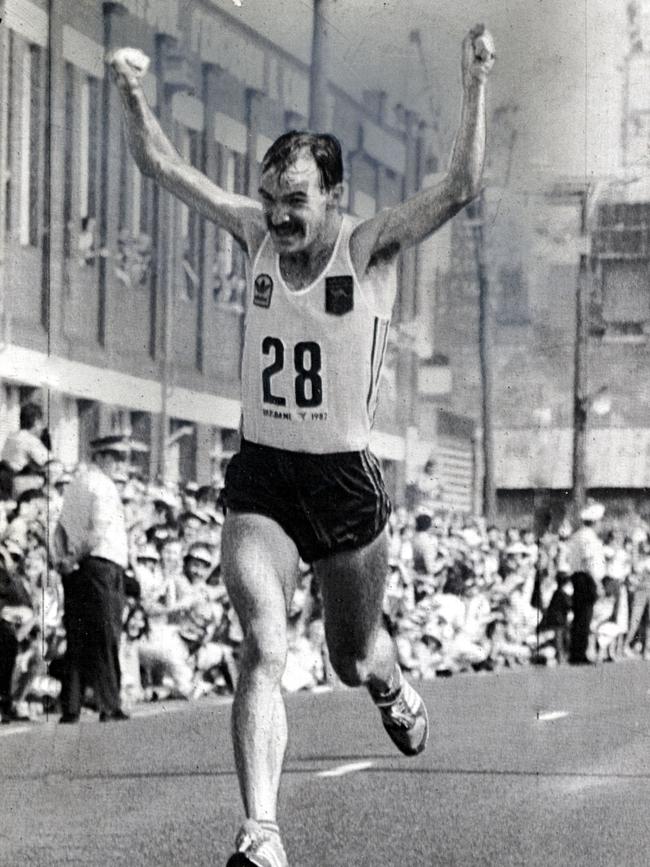 Robert de Castella crosses the finish line in jubilation to win the 1982 Commonwealth Games marathon in South Brisbane.