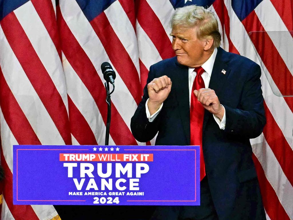 TOPSHOT - Former US President and Republican presidential candidate Donald Trump dances after speaking during an election night event at the West Palm Beach Convention Center in West Palm Beach, Florida, early on November 6, 2024. Republican former president Donald Trump closed in on a new term in the White House early November 6, 2024, just needing a handful of electoral votes to defeat Democratic Vice President Kamala Harris. (Photo by Jim WATSON / AFP)