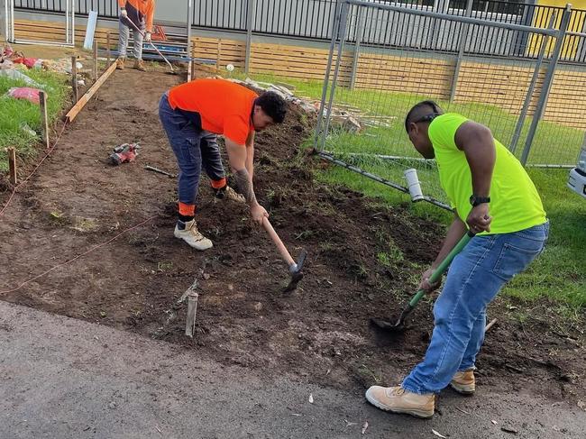 Sydney Roosters prop Taylor Losalu (left) on the tools as a concreter.