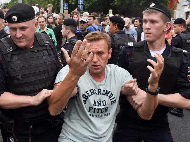 Alexei Navalny is detained by Russian police during a march to protest against the alleged impunity of law enforcement agencies in Moscow in 2019. Picture: AFP