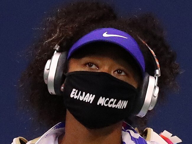 NEW YORK, NEW YORK - SEPTEMBER 02: Naomi Osaka of Japan walks in wearing a mask with the name Elijah McClain on it before her Womens Singles second round match against  Camila Giorgi of Italy on Day Three of the 2020 US Open at the USTA Billie Jean King National Tennis Center on September 2, 2020 in the Queens borough of New York City. McClain was shot and killed by police on Aurora, Colorado August 24, 2020. (Photo by Matthew Stockman/Getty Images)