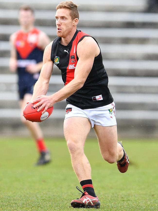 Brad Cox-Goodyer in full flight against North Hobart earlier in the year. Picture: Steve Bell